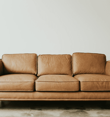 Warm leather sofa in a minimalist living room